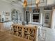 Airy living room featuring tray ceilings, decorative fans, and stylish furnishings at 22623 Morning Glory Cir, Bradenton, FL 34202