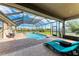 Relaxing screened pool with plenty of room for lounging and lush landscaping at 22623 Morning Glory Cir, Bradenton, FL 34202