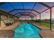 The screened-in pool features a spa and offers stunning backyard views at 22623 Morning Glory Cir, Bradenton, FL 34202