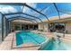 A luxurious, screened-in pool and spa create a relaxing outdoor oasis at 22623 Morning Glory Cir, Bradenton, FL 34202