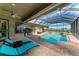 Inviting screened pool area with a beautiful pool, brick patio and comfortable lounge seating at 22623 Morning Glory Cir, Bradenton, FL 34202