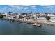 A wide shot of homes, docks, palm trees, and water creating a tropical view at 2601 Gulf N Dr # B16, Bradenton Beach, FL 34217