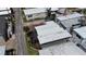 Aerial shot of homes with dark roof tops, surrounded by lush landscaping and paved roads at 2601 Gulf N Dr # B16, Bradenton Beach, FL 34217