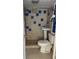 Bathroom featuring a pedestal sink and tiled shower at 2601 Gulf N Dr # B16, Bradenton Beach, FL 34217