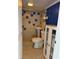 Bathroom with walk-in shower, pedestal sink, and storage cabinet with blue and white color scheme at 2601 Gulf N Dr # B16, Bradenton Beach, FL 34217