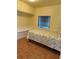 Charming single bedroom with built-in storage, wainscoting, and a cozy bed with floral bedding at 2601 Gulf N Dr # B16, Bradenton Beach, FL 34217