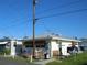Charming home exterior with awning windows, benches, and landscaping, creating curb appeal at 2601 Gulf N Dr # B16, Bradenton Beach, FL 34217