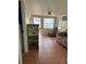 Cozy living room featuring tile floors, neutral paint, and views to the outside at 2601 Gulf N Dr # B16, Bradenton Beach, FL 34217