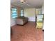 Inviting living room with tiled floors, natural light, and a comfortable sofa for relaxation at 2601 Gulf N Dr # B16, Bradenton Beach, FL 34217