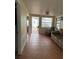 Cozy living room with comfortable seating, tiled floors, and natural light from windows and entrance at 2601 Gulf N Dr # B16, Bradenton Beach, FL 34217