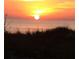 Beautiful sunset over the water, casting a warm glow over the horizon and creating a serene ambiance at 2601 Gulf N Dr # B16, Bradenton Beach, FL 34217