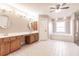 Spacious bathroom with a double vanity, soaking tub, and walk-in shower at 27425 Jones Loop Rd, Punta Gorda, FL 33982
