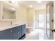 Bathroom features marble floors, a glass shower, and a stylish vanity with ample counter space at 27425 Jones Loop Rd, Punta Gorda, FL 33982