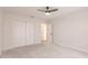 Bright bedroom with a closet and an opening to a hall at 27425 Jones Loop Rd, Punta Gorda, FL 33982