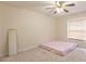 Bedroom featuring neutral walls, carpet, and a window at 27425 Jones Loop Rd, Punta Gorda, FL 33982