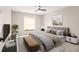 Bedroom featuring neutral walls, carpet, and modern furniture at 27425 Jones Loop Rd, Punta Gorda, FL 33982