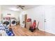 Laundry room with appliances, ample storage, and durable laminate flooring at 27425 Jones Loop Rd, Punta Gorda, FL 33982