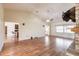 Spacious living room featuring hardwood floors, ceiling fan, and neutral paint at 27425 Jones Loop Rd, Punta Gorda, FL 33982