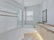Bathroom featuring dual sinks, vanity, garden tub and walk-in shower at 4708 Clipper Dr, Bradenton, FL 34208