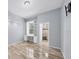 Bedroom featuring an ensuite bathroom, built-in shelving and wood-look flooring at 4708 Clipper Dr, Bradenton, FL 34208