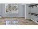 Bedroom featuring wood-look tile floors and large bright window at 4708 Clipper Dr, Bradenton, FL 34208
