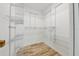 Spacious walk-in closet with shelving, racks and wood-look flooring at 4708 Clipper Dr, Bradenton, FL 34208