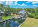 Charming waterfront property featuring a private dock and covered boat lift, perfect for boating enthusiasts at 4708 Clipper Dr, Bradenton, FL 34208