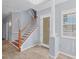 The beautiful light blue foyer features tile floors, a decorative glass front door and staircase at 4708 Clipper Dr, Bradenton, FL 34208