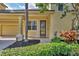 Charming home featuring a beautiful front door, lush landscaping, and a welcoming entrance at 4708 Clipper Dr, Bradenton, FL 34208