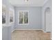 Sun-filled living room with neutral paint, tile floors, and plantation shutters at 4708 Clipper Dr, Bradenton, FL 34208