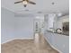 The spacious open floor plan includes tile flooring, neutral paint, and a view of the kitchen at 4708 Clipper Dr, Bradenton, FL 34208