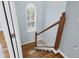 Wooden staircase with painted risers and balusters leading upstairs at 4708 Clipper Dr, Bradenton, FL 34208