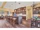 Open kitchen with large island, breakfast bar, modern appliances, and ample cabinet space at 603 Harbor Shore Dr, Nokomis, FL 34275