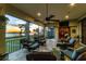 Inviting screened lanai with comfortable seating, ceiling fans, and sunset water views at 603 Harbor Shore Dr, Nokomis, FL 34275