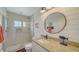 Clean bathroom features tile floors, a glass enclosed shower, shiplap, and modern fixtures at 653 Cedars Ct, Longboat Key, FL 34228