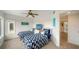 Nicely decorated guest bedroom with carpet, 2 beds, ceiling fan and a TV, plus nice views at 653 Cedars Ct, Longboat Key, FL 34228