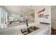 An open-concept layout seamlessly blends the kitchen and living area, complete with a breakfast bar at 653 Cedars Ct, Longboat Key, FL 34228