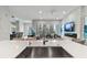 Open kitchen design with island seating and view into the living room at 711 S Palm Ave # 303, Sarasota, FL 34236
