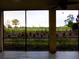A view from the Lanai onto the property's lush green landscape at 7486 Divot Loop # 7486, Bradenton, FL 34202