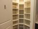 A well-organized pantry featuring open shelving and storage space at 7486 Divot Loop # 7486, Bradenton, FL 34202
