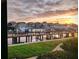 Scenic waterfront sunset view from condo featuring well-maintained docks and lush greenery at 4750 Brittany S Dr # 24, St Petersburg, FL 33715