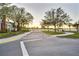A street view features mature trees and landscaping to provide a serene backdrop to the property at 514 Riverside E Dr, Bradenton, FL 34208