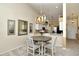 Dining area featuring a modern chandelier and comfortable seating, bright and inviting atmosphere at 5281 Mahogany Run Ave # 822, Sarasota, FL 34241