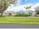 Well-maintained single-story home with a large front yard and attractive landscaping at 536 Ketch Ln, Longboat Key, FL 34228