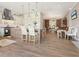 Spacious open kitchen and dining area with pendant lighting and hardwood floors throughout at 536 Ketch Ln, Longboat Key, FL 34228