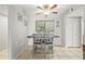 Cozy dining area with seating for four and a view to the exterior at 6703 Midnight Pass Rd # 108B, Sarasota, FL 34242