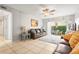 Bright living room featuring neutral tile floors and sliding door access to a patio at 6703 Midnight Pass Rd # 108B, Sarasota, FL 34242