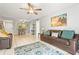 Comfortable living area with tile floors and ceiling fan at 6703 Midnight Pass Rd # 108B, Sarasota, FL 34242