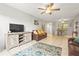 Comfortable living area with tile floors and ceiling fan at 6703 Midnight Pass Rd # 108B, Sarasota, FL 34242