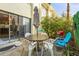 Private patio with outdoor seating and a small grill at 6703 Midnight Pass Rd # 108B, Sarasota, FL 34242